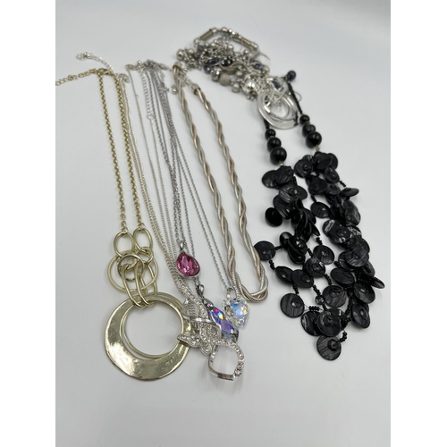 2391 - A collection of assorted costume jewellery to include necklaces, watches etc.