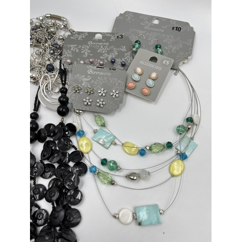 2391 - A collection of assorted costume jewellery to include necklaces, watches etc.