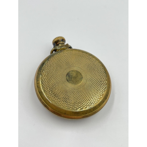 2400 - A Smiths brass cased mechanical pocket watch