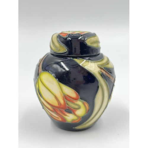 421A - A boxed Moorcroft miniature jar and cover - approx. 6cm high