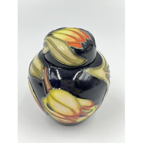 421A - A boxed Moorcroft miniature jar and cover - approx. 6cm high