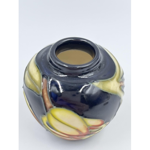 421A - A boxed Moorcroft miniature jar and cover - approx. 6cm high