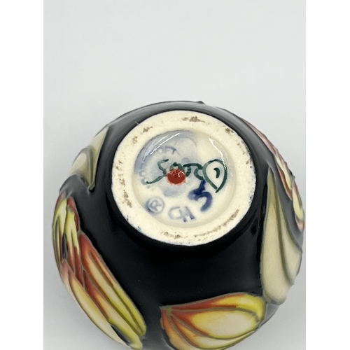 421A - A boxed Moorcroft miniature jar and cover - approx. 6cm high