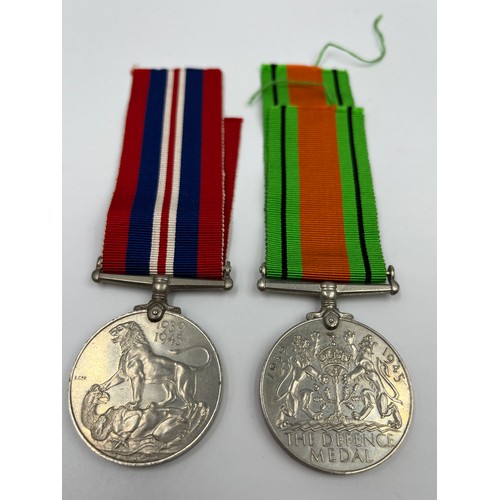 65 - Three items, two WWII British medals, Defence and War with paperwork and ribbons and one 1965 Winsto... 