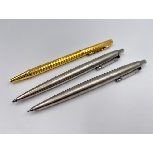 126 - Three writing instruments, one Parker ballpoint pen, one Parker pencil and one gold tone retractable... 