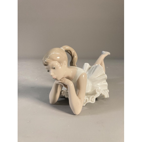 473 - Three ceramic figurines, two Nao by Lladro ballerinas and one Royal Doulton Bedtime - HN 1978