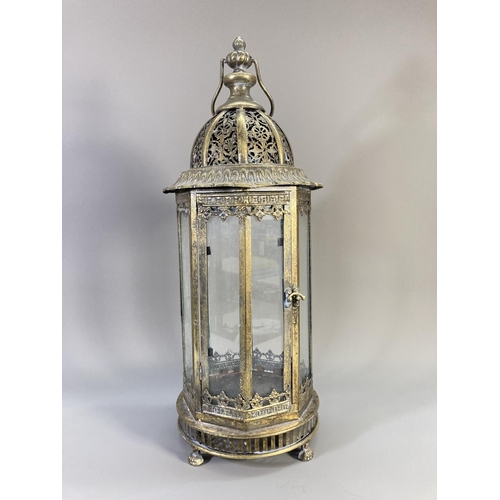 510 - A pair of Middle Eastern style brass effect and glass lanterns - approx. 55cm high