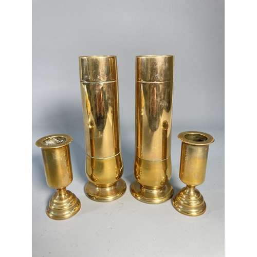 523 - Four pieces of brass Trench Art, two 19cm vases and two 10cm candlesticks