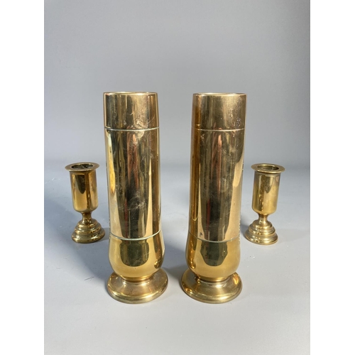 523 - Four pieces of brass Trench Art, two 19cm vases and two 10cm candlesticks