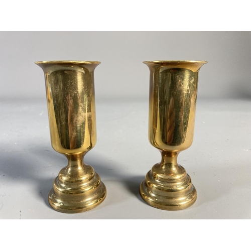 523 - Four pieces of brass Trench Art, two 19cm vases and two 10cm candlesticks