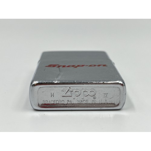 123 - Three assorted Zippo cigarette lighters, one Cunard, one Snap-On and one other