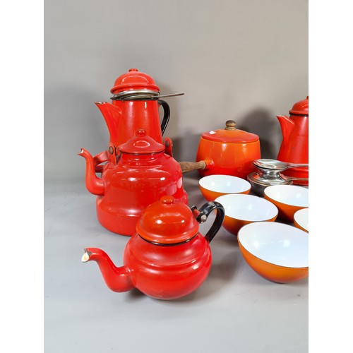 532 - A collection of mid 20th century enamel kitchenware to include red coffee pot, green circular storag... 