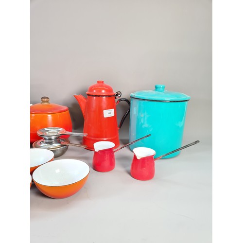 532 - A collection of mid 20th century enamel kitchenware to include red coffee pot, green circular storag... 