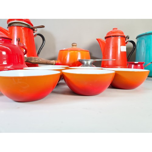 532 - A collection of mid 20th century enamel kitchenware to include red coffee pot, green circular storag... 