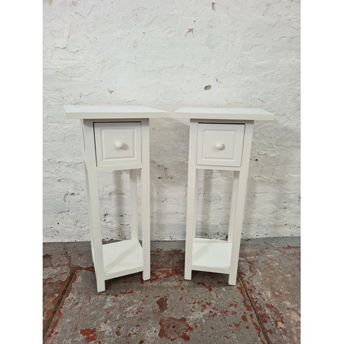 1176B - A pair of modern white painted square top two-tier bedside tables - approx. 71cm high x 32cm square