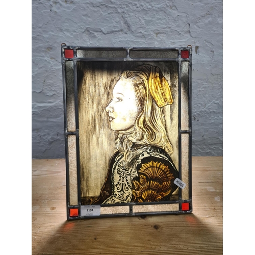 1194 - A Dutch style hand painted portrait of a female on stained glass - approx. 33cm high x 25cm wide