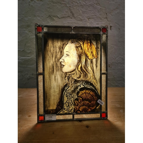 1194 - A Dutch style hand painted portrait of a female on stained glass - approx. 33cm high x 25cm wide