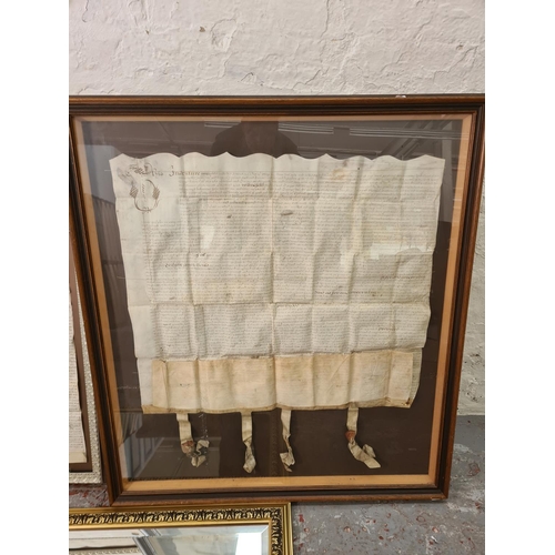 1202 - Three items, one gilt framed bevelled edge mirror and two antique framed indentures - largest approx... 