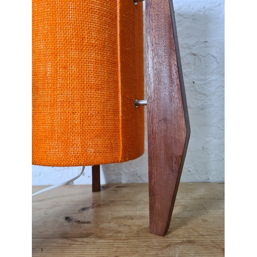 1157A - Three teak table lamps, two 1960s - largest approx. 34cm high and one mid 20th century style with or... 