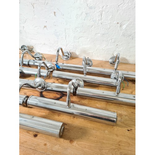 1163A - Eleven chrome plated wall mountable picture lights - approx. 38cm wide