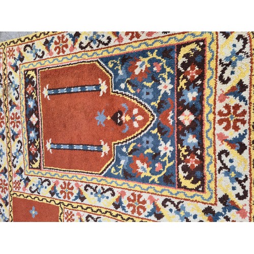 1181 - A mid 20th century multi coloured rug