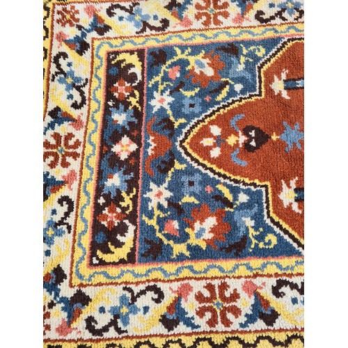 1181 - A mid 20th century multi coloured rug