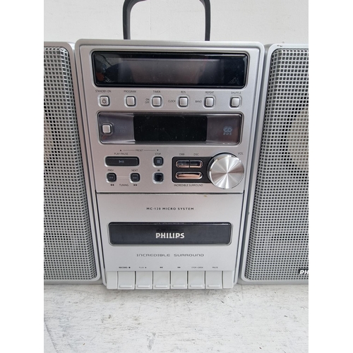 1272 - A Philips MC-120 micro hi-fi system comprising CD player, cassette recorder and three band tuner/amp... 