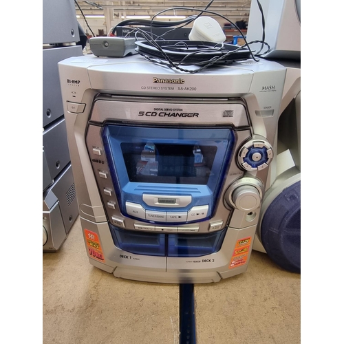 1290 - Two items, one Panasonic SA-AK200 five CD changer stereo system with remote control and a pair of ma... 