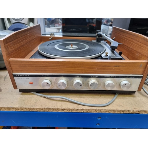 1292 - A Ferguson record player comprising BSR P128 four speed turntable, amplifier and a pair of model 340... 