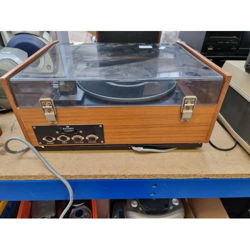 1292 - A Ferguson record player comprising BSR P128 four speed turntable, amplifier and a pair of model 340... 