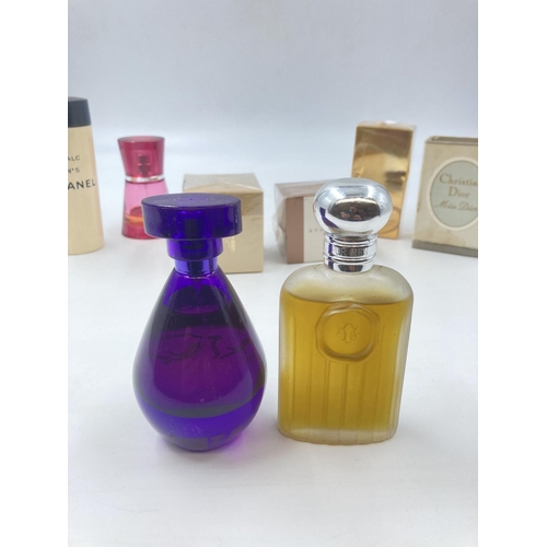 703 - A collection of various cosmetic accessories to include Burberry Tender Touch womens perfume, Christ... 