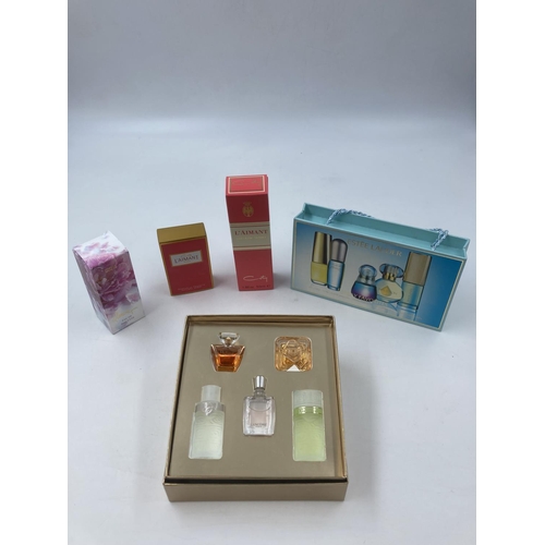 705 - A collection of assorted perfumes to include Lancome 5-piece set, Estee Lauder 5-piece set, Coty L'A... 