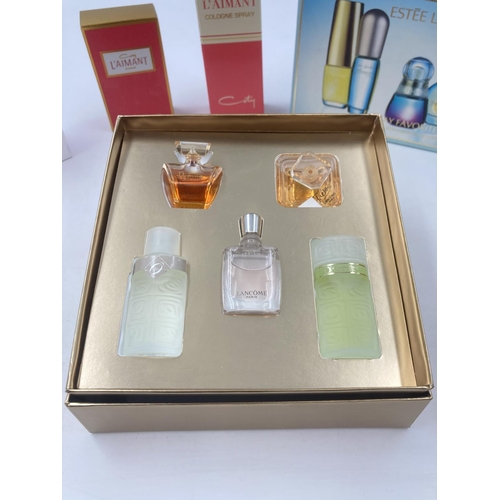 705 - A collection of assorted perfumes to include Lancome 5-piece set, Estee Lauder 5-piece set, Coty L'A... 