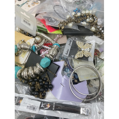 721 - A large collection of assorted costume jewellery to include bracelets, earrings, necklaces etc.