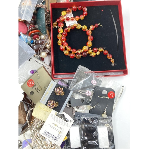 750 - A large collection of assorted costume jewellery to include earrings, necklaces etc.