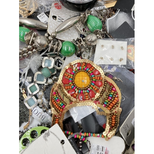 750 - A large collection of assorted costume jewellery to include earrings, necklaces etc.