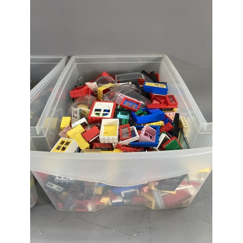 677 - Three boxes containing a large quantity of Lego