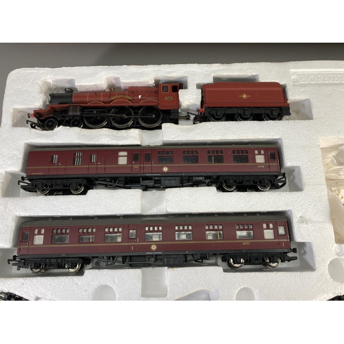 604 - A boxed Hornby R1025 Harry Potter & The Philosophers Stone Hogwarts Express electric train set