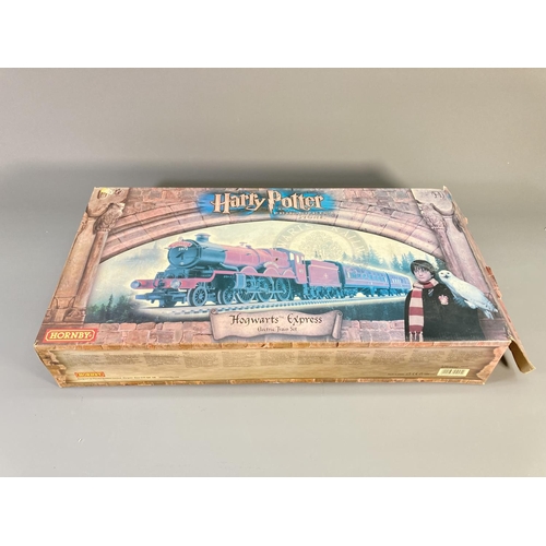 604 - A boxed Hornby R1025 Harry Potter & The Philosophers Stone Hogwarts Express electric train set