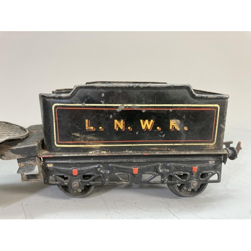 641 - An early 20th century Bing live steam O gauge 0-4-0 Jupiter 1902 locomotive and tender in black L.N.... 