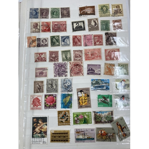 767 - Seven stamp albums containing a large collection of assorted World Wide stamps and First Day covers ... 