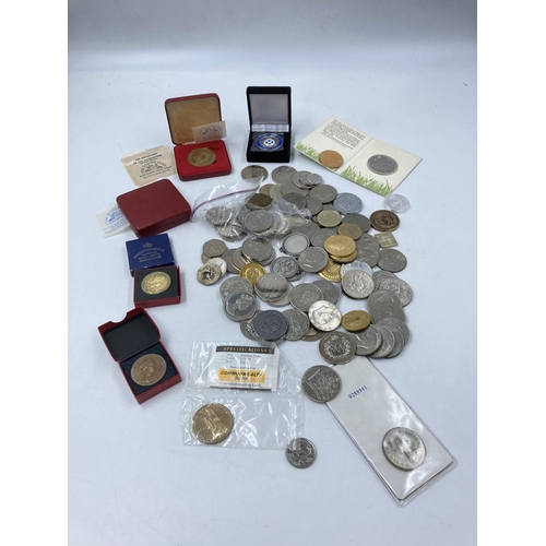 768 - A collection of coins, medals, medallions, tokens and commemorative items