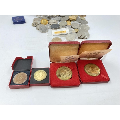 768 - A collection of coins, medals, medallions, tokens and commemorative items