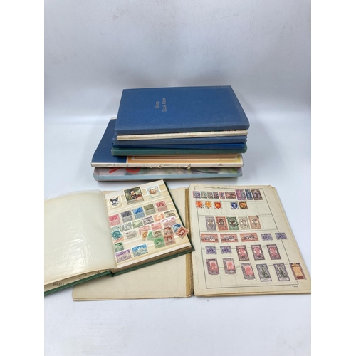 759 - A large collection of various stamp albums containing assorted stamps to include World Wide, nature,... 