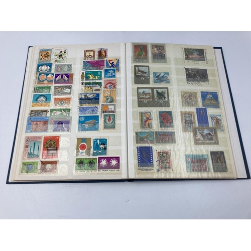 759 - A large collection of various stamp albums containing assorted stamps to include World Wide, nature,... 