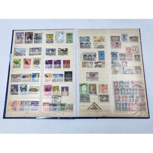 759 - A large collection of various stamp albums containing assorted stamps to include World Wide, nature,... 