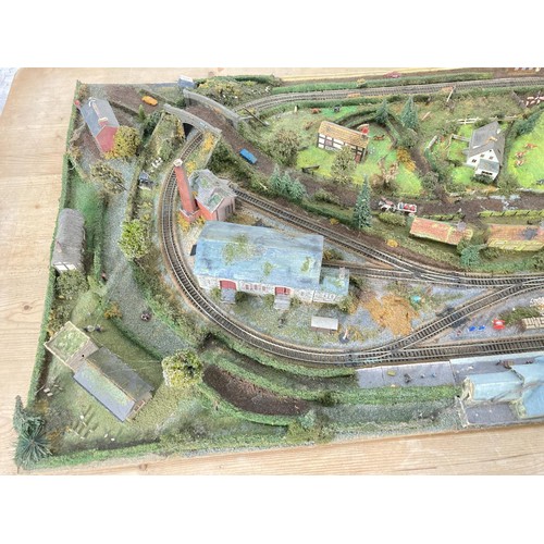 612A - A scratch built N gauge model railway track with building and accessories - approx. 125cm x 64cm