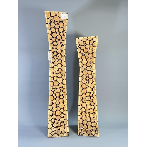 811 - Two Vietnamese hand-crafted floor standing candle holders - largest approx. 80cm high