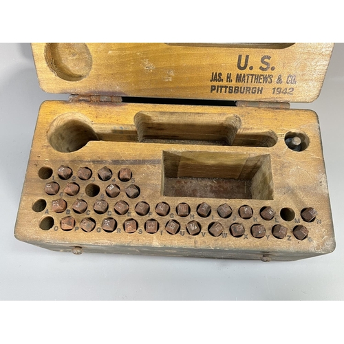 823 - A WWII American Jas. H. Matthews & Co. dog tag marking kit, dated 1942