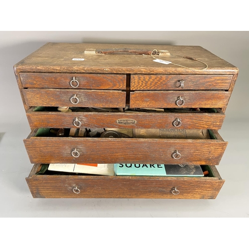 825 - A 1940s Fearcleve Products of Cheltenham oak cased seven drawer engineer's tool chest containing a l... 